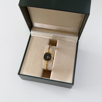 Gucci 1990s Black Dial Gold Plated Bangle Watch