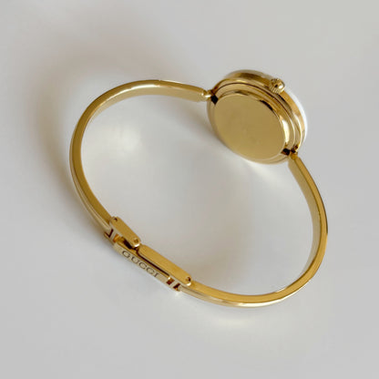 Gucci 1980s Interchangeable Bezel Gold Plated Bangle Watch with 12 bezels, case