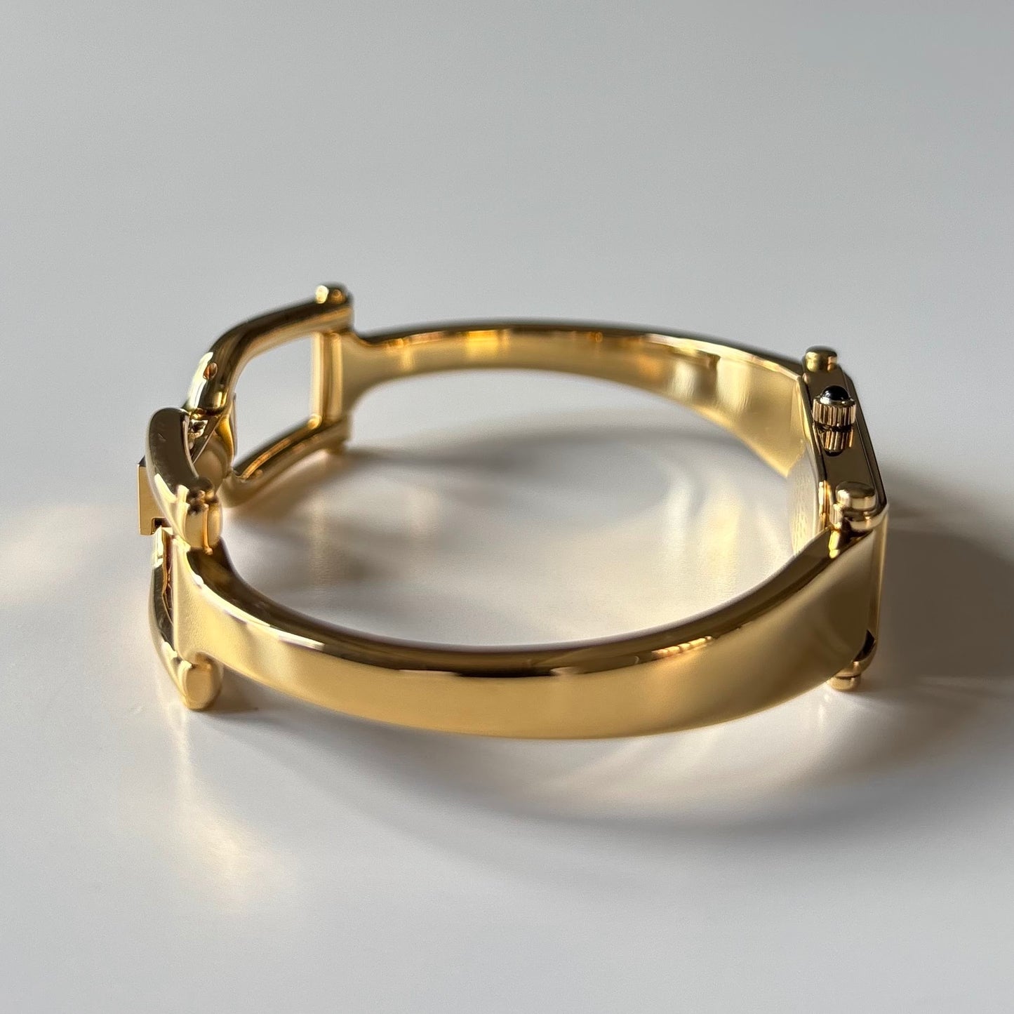 Gucci 1990s Black Rectangular Dial Gold Plated Bangle Watch