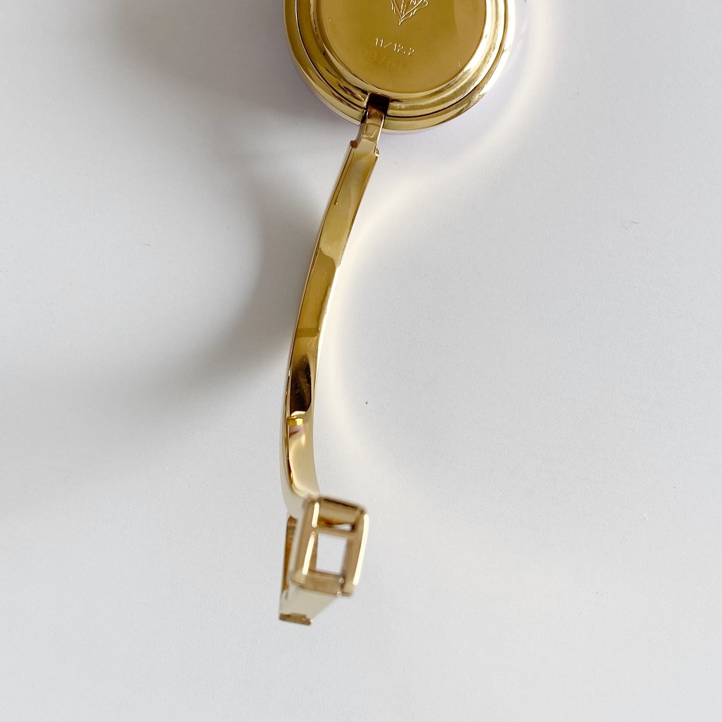 Gucci 1990s Interchangeable Bezel Gold Plated Bangle Watch with 12 bezels, case
