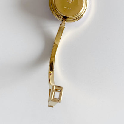 Gucci 1990s Interchangeable Bezel Gold Plated Bangle Watch with 12 bezels, case