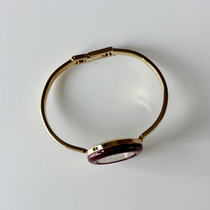 Gucci 1990s Interchangeable Bezel Gold Plated Bangle Watch with 12 bezels, case