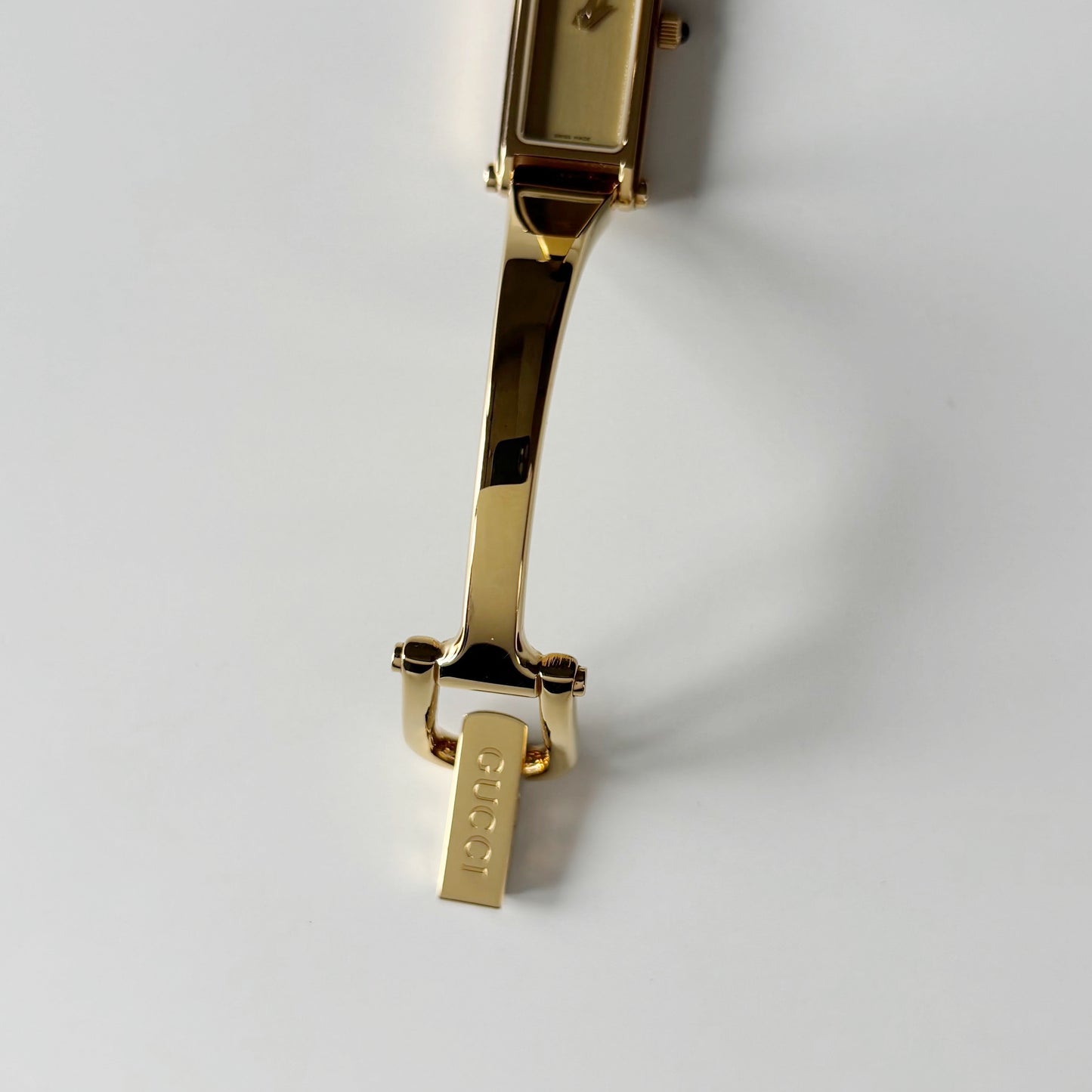 Gucci 1990s Gold Rectangular Dial Gold Plated Bangle Watch