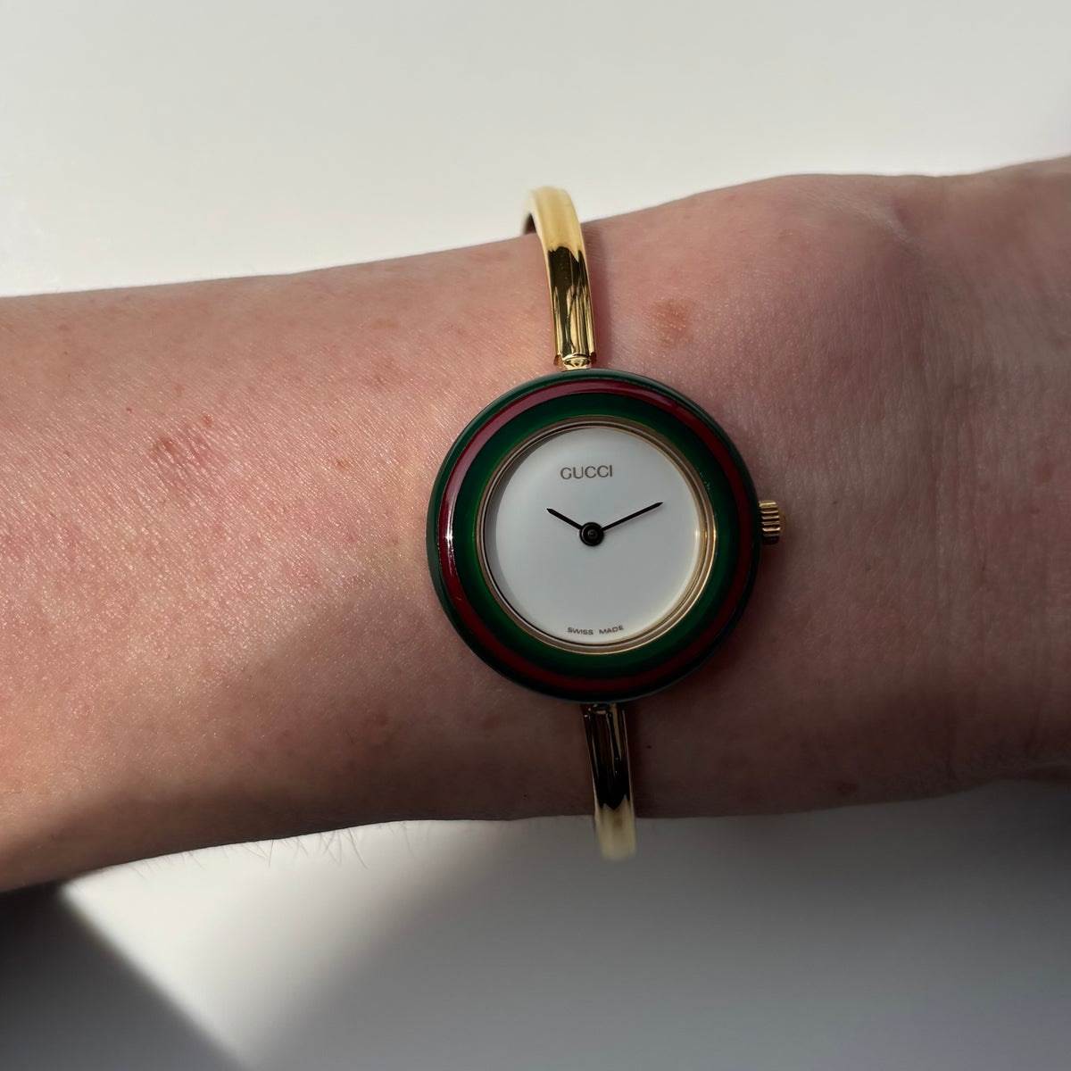 Gucci 1990s Interchangeable Bezel Gold Plated Bangle Watch with 12 bezels, case