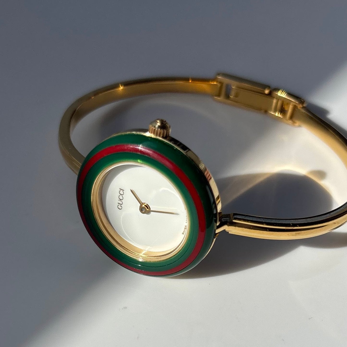 Gucci 1990s Interchangeable Bezel Gold Plated Bangle Watch with 12 bezels, case
