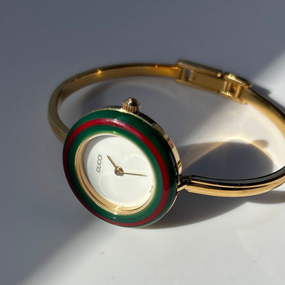 Gucci 1990s Interchangeable Bezel Gold Plated Bangle Watch with 12 bezels, case