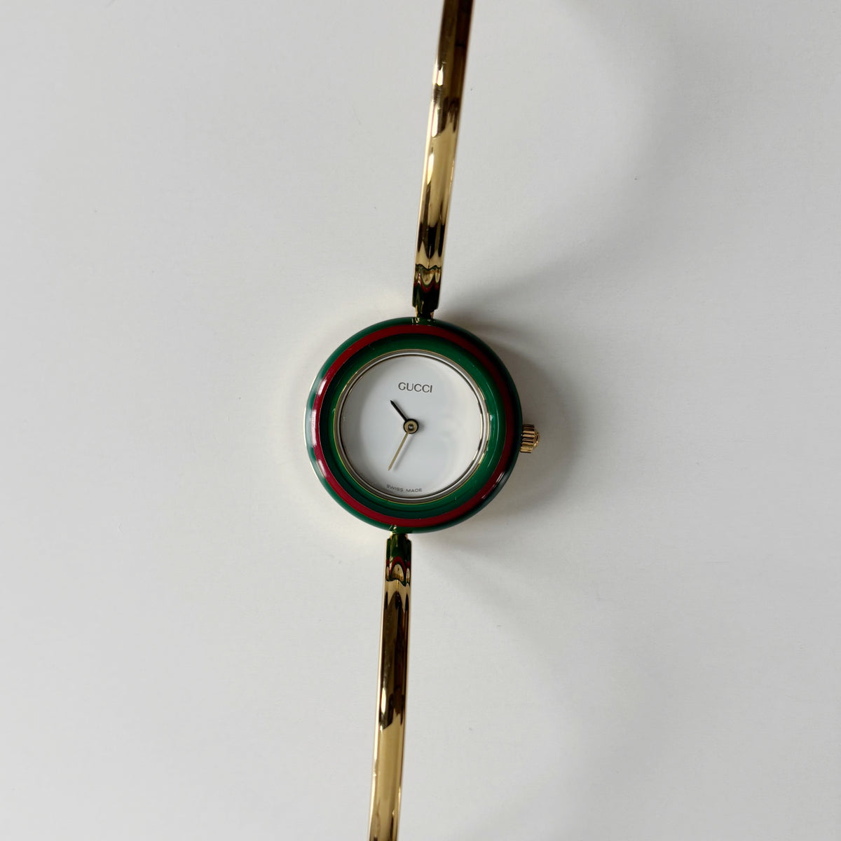 Gucci 1990s Interchangeable Bezel Gold Plated Bangle Watch with 12 bezels, case
