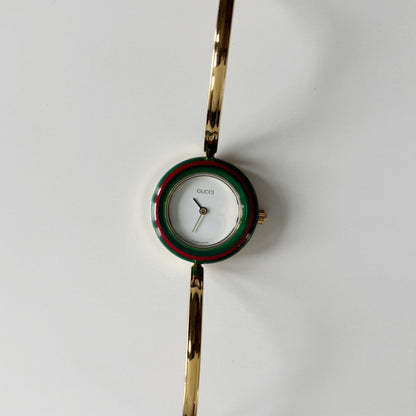 Gucci 1990s Interchangeable Bezel Gold Plated Bangle Watch with 12 bezels, case