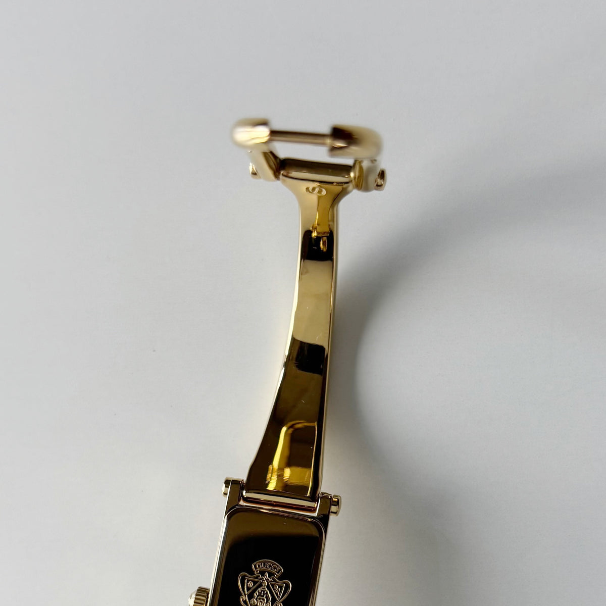 Gucci 1990s Rectangular Gold Dial Gold Plated Bangle Watch (Small)