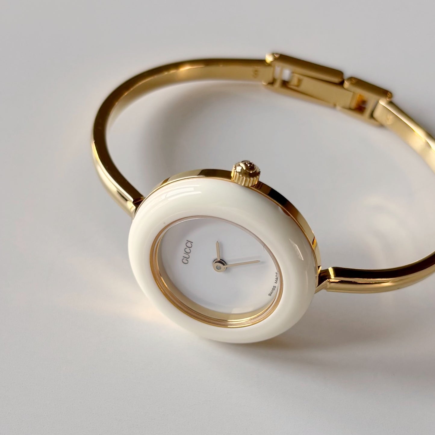 Gucci 1990s Interchangeable Bezel Gold Plated Bangle Watch with case, 12 bezels (Small)