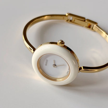 Gucci 1990s Interchangeable Bezel Gold Plated Bangle Watch with case, 12 bezels (Small)