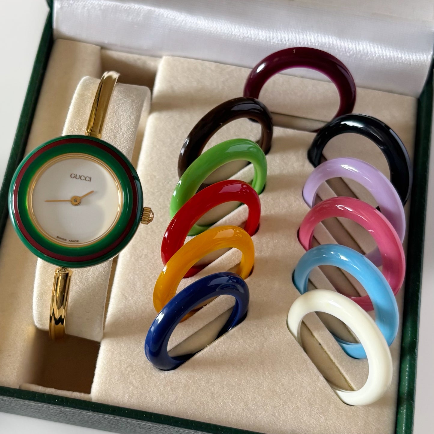 Gucci 1990s Interchangeable Bezel Gold Plated Bangle Watch with 12 bezels, case
