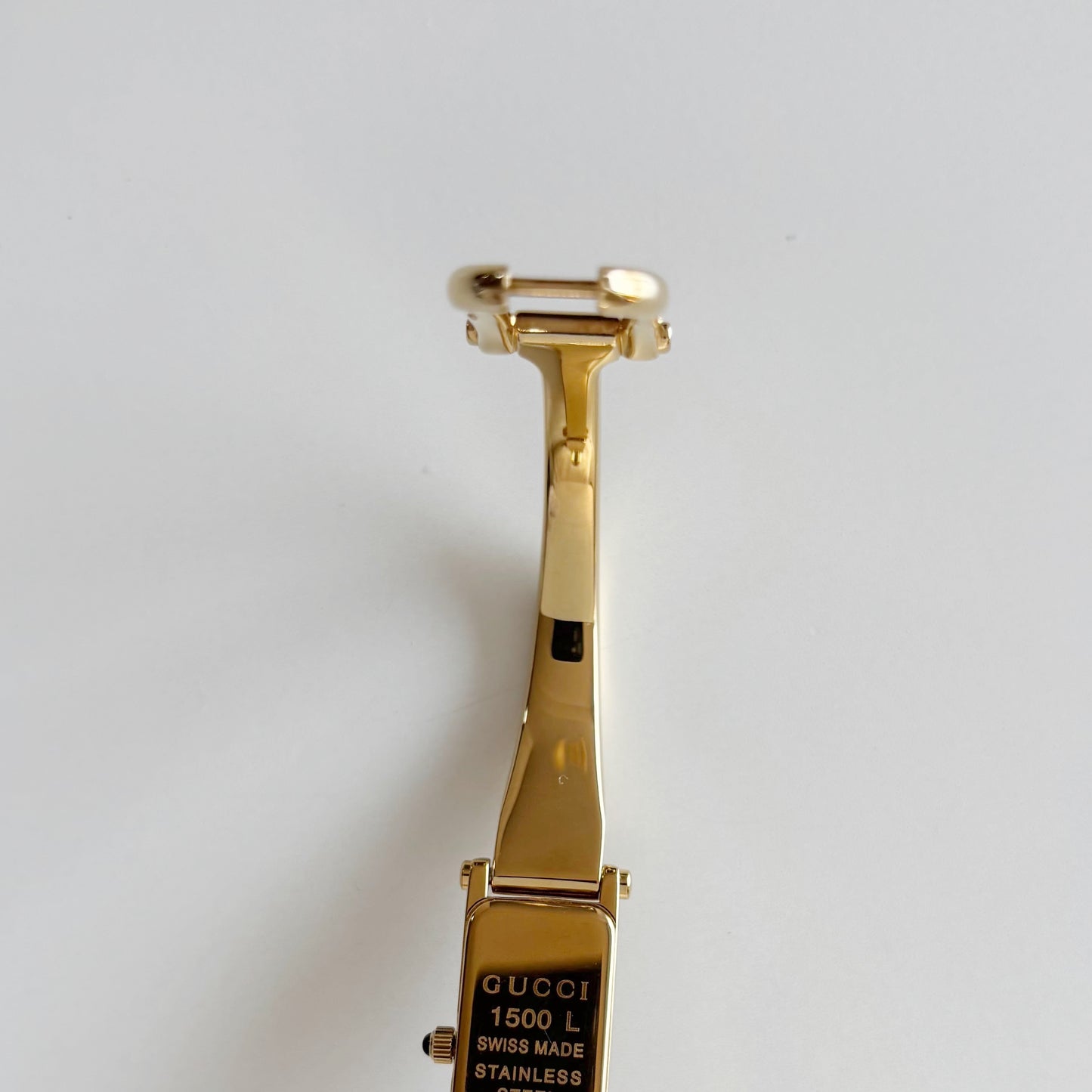 Gucci 1990s Rectangular Gold Dial Gold Plated Bangle Watch