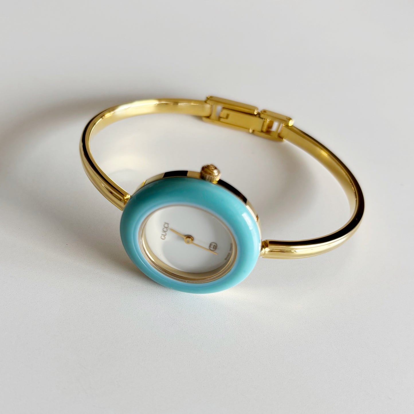 Gucci 1990s Interchangeable Bezel Gold Plated Bangle Watch with 12 bezels, case