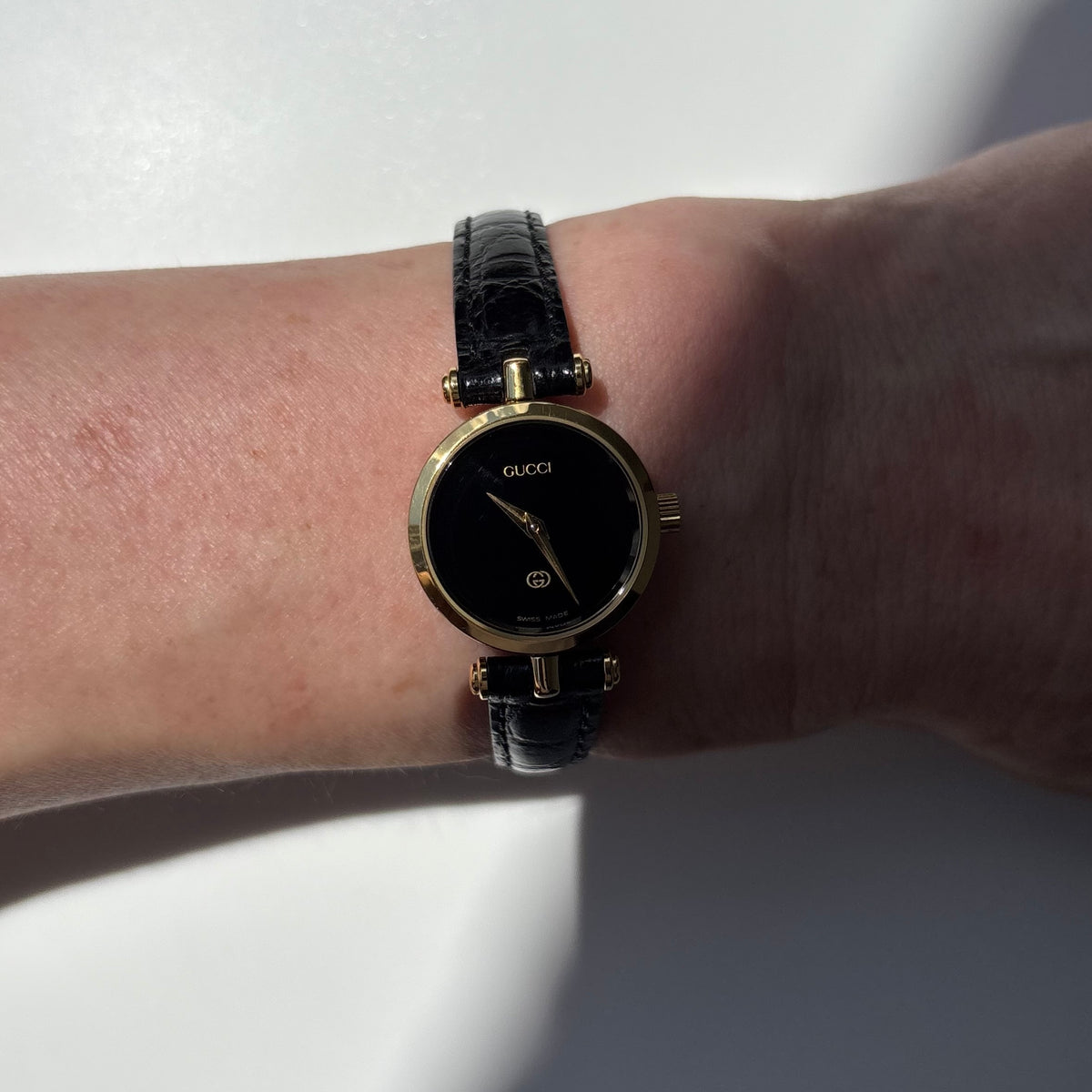 Gucci 1980s Black Dial Round Gold-Plated Watch