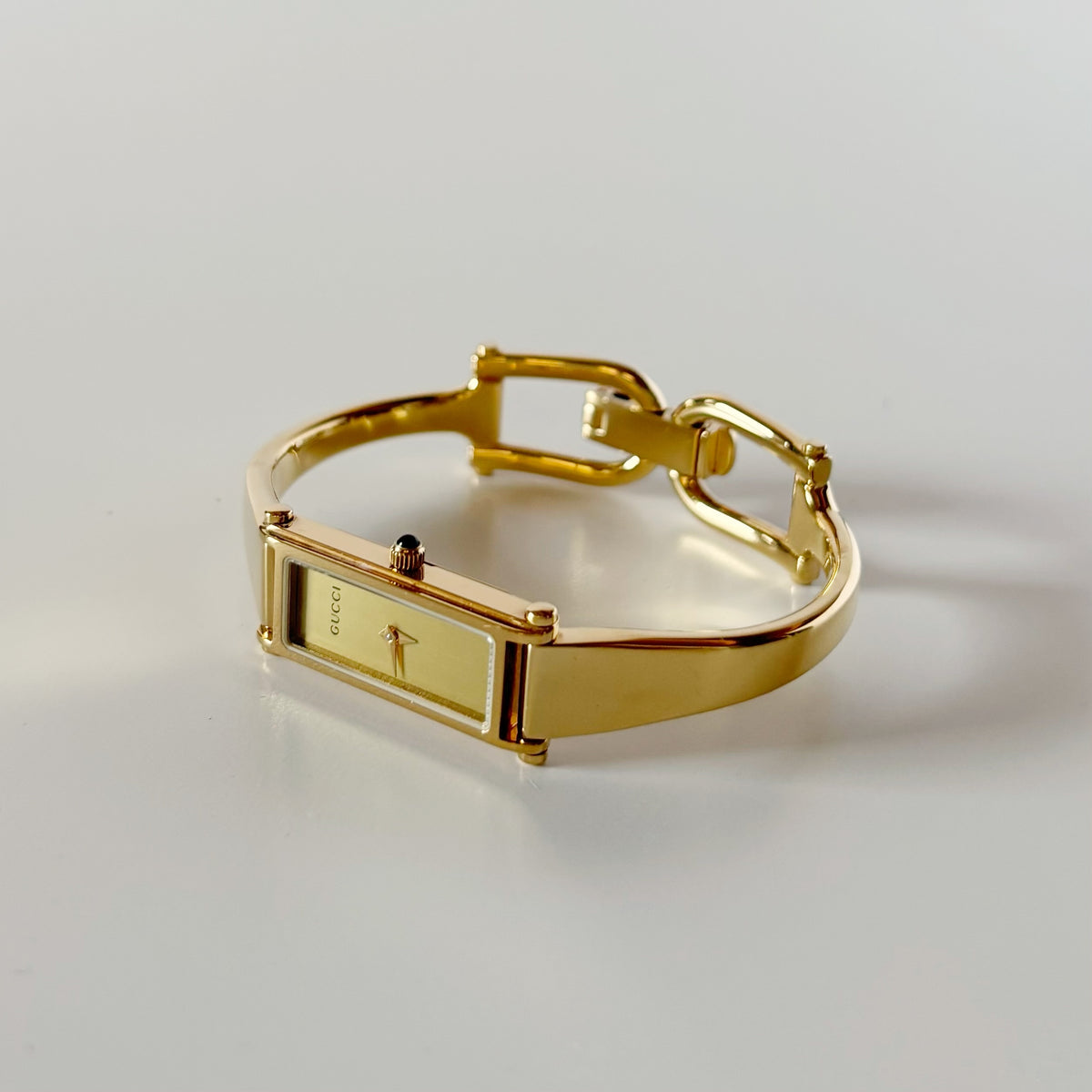 Gucci 1990s Rectangular Gold Dial Gold-Plated Watch