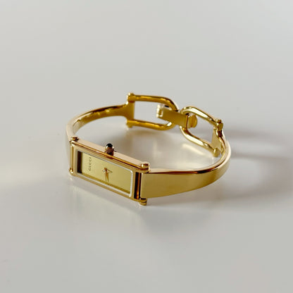 Gucci 1990s Rectangular Gold Dial Gold-Plated Watch