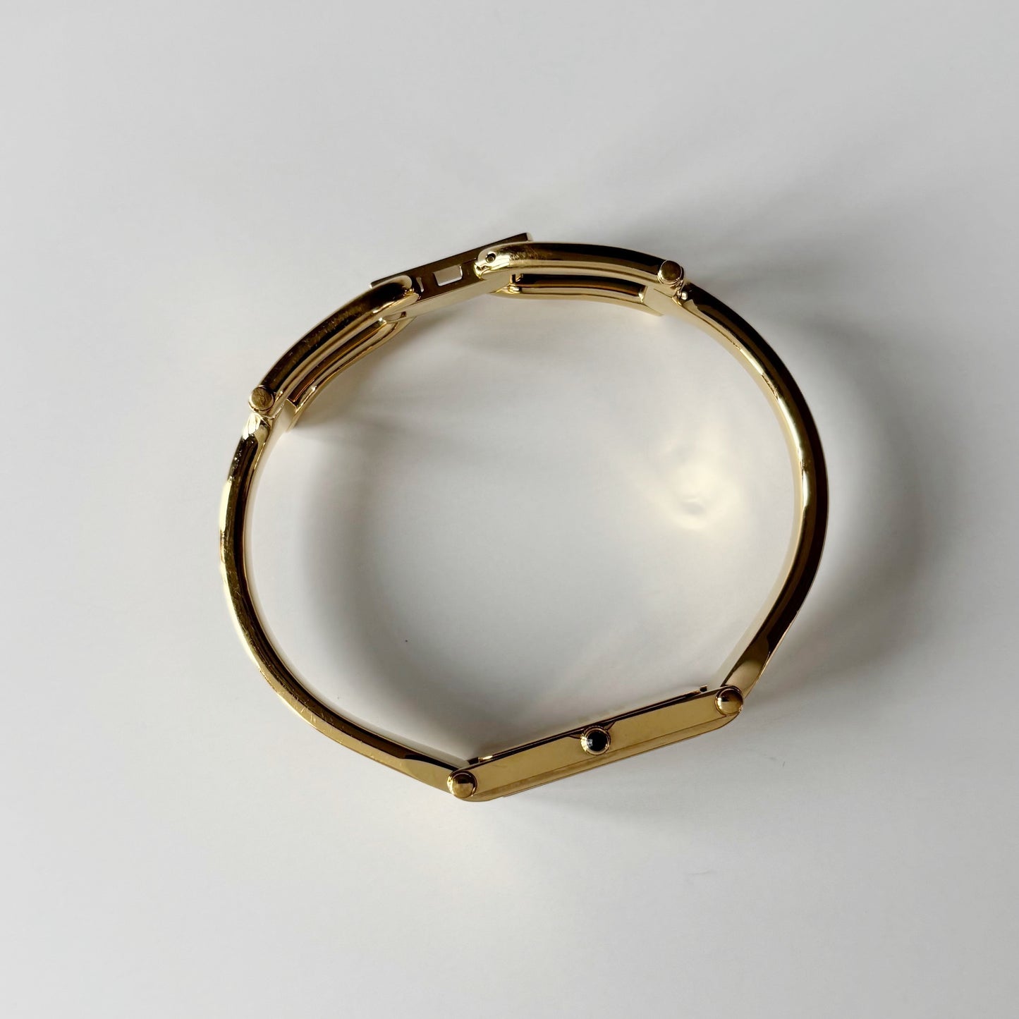 Gucci 1990s Gold Rectangular Dial Gold Plated Bangle Watch