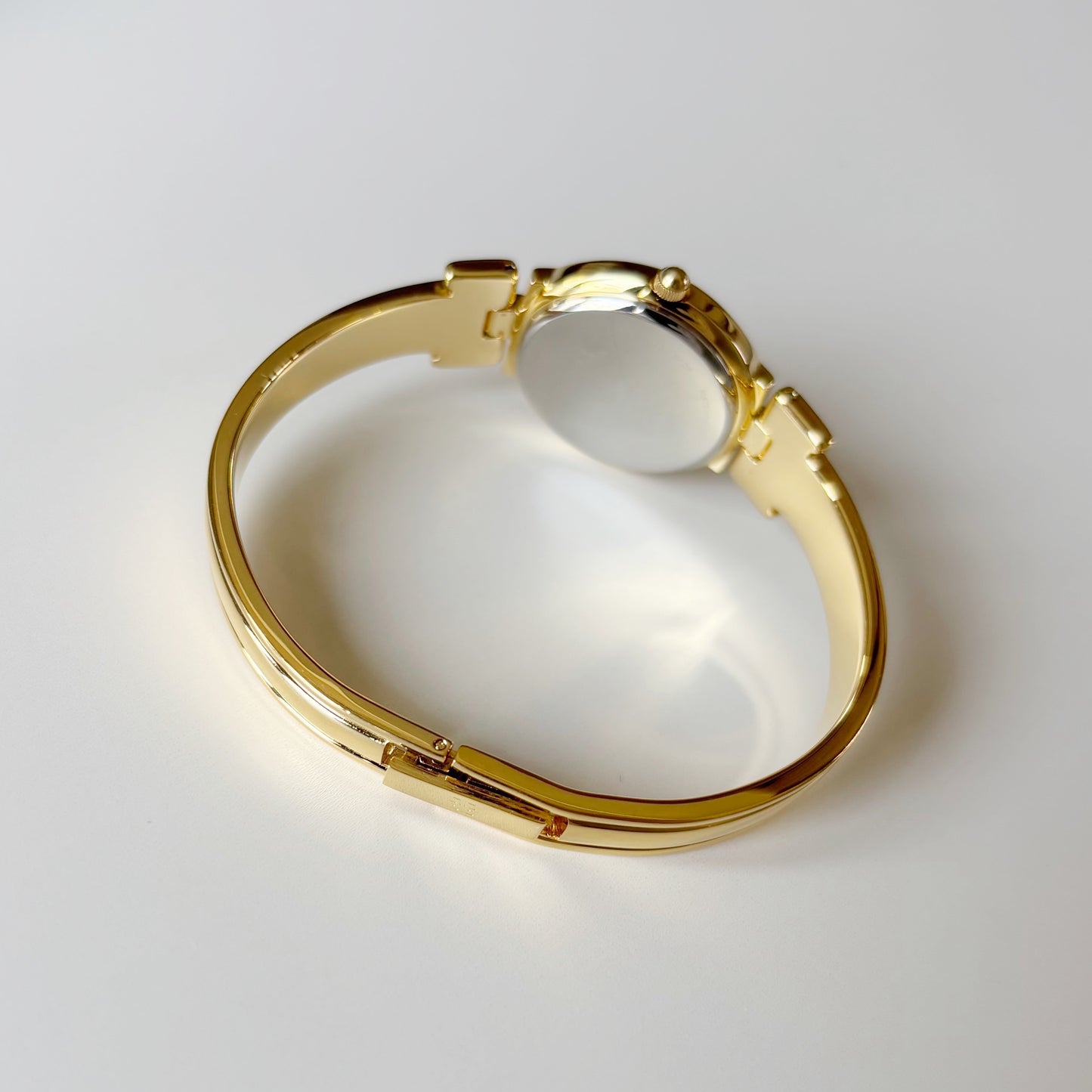 Givenchy 1990s Black Round Dial Gold Plated Bangle Watch