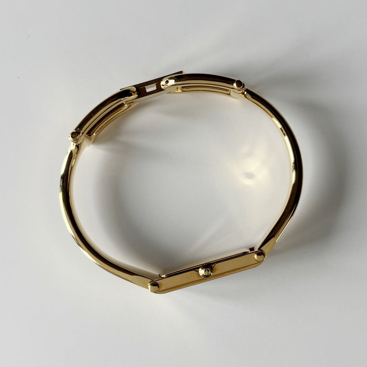 Gucci 1990s Gold Rectangular Dial Gold Plated Bangle Watch
