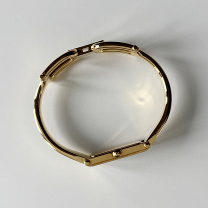 Gucci 1990s Gold Rectangular Dial Gold Plated Bangle Watch