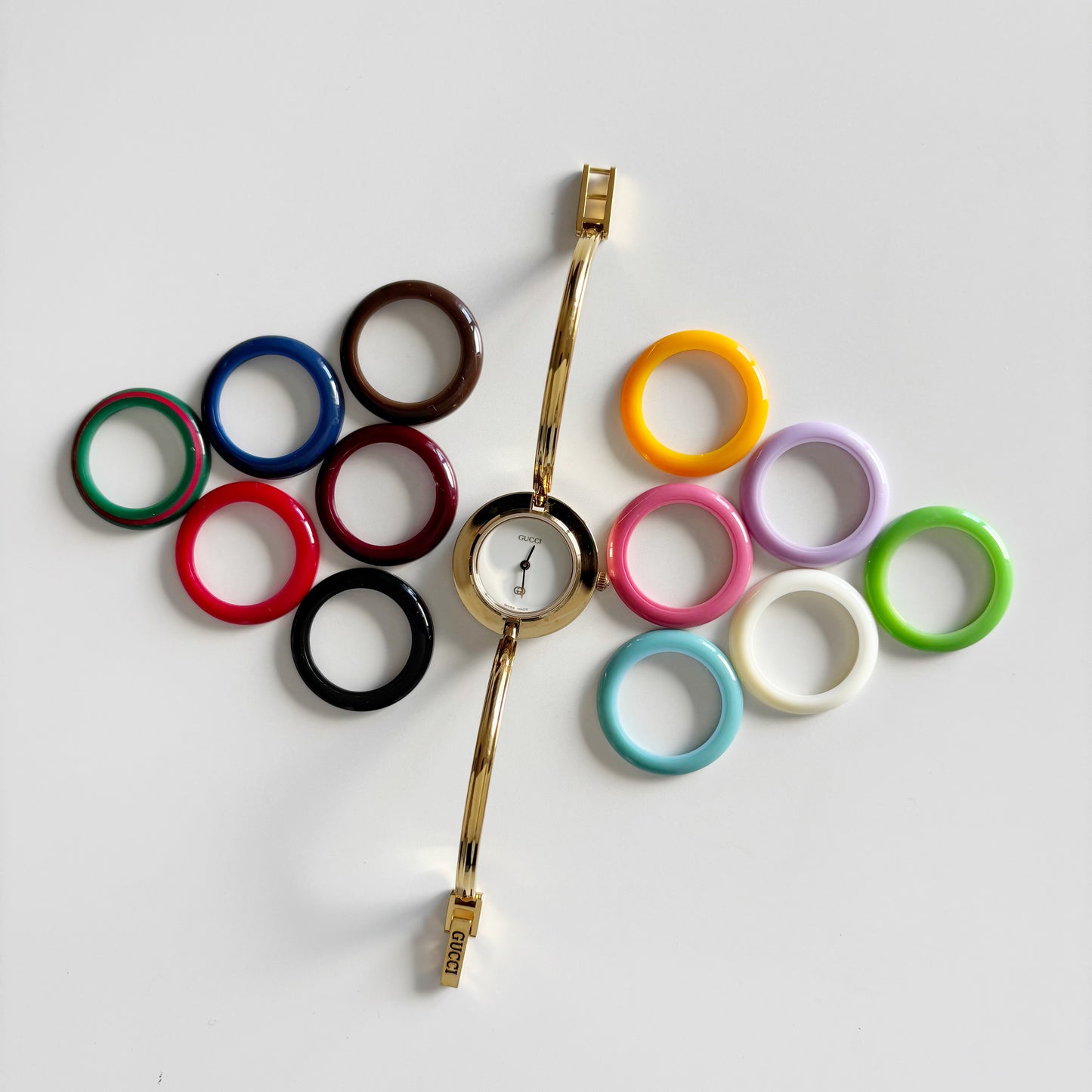 Gucci 1990s Interchangeable Bezel Gold Plated Bangle Watch with 12 bezels, case