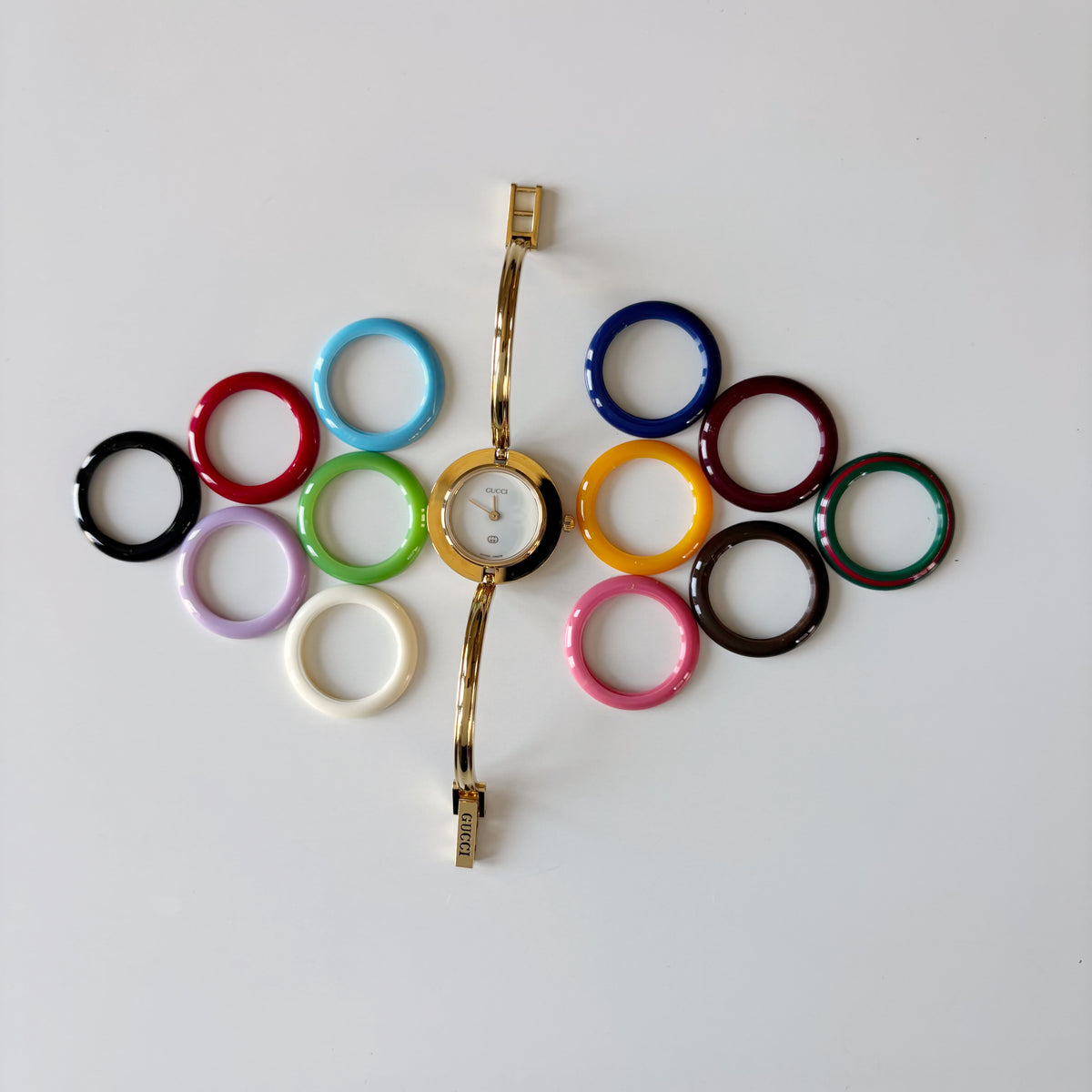 Gucci 1990s Interchangeable Bezel Gold Plated Bangle Watch with 12 bezels, case (Small)