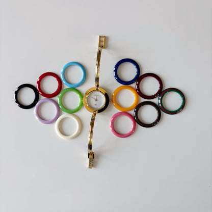 Gucci 1990s Interchangeable Bezel Gold Plated Bangle Watch with 12 bezels, case (Small)