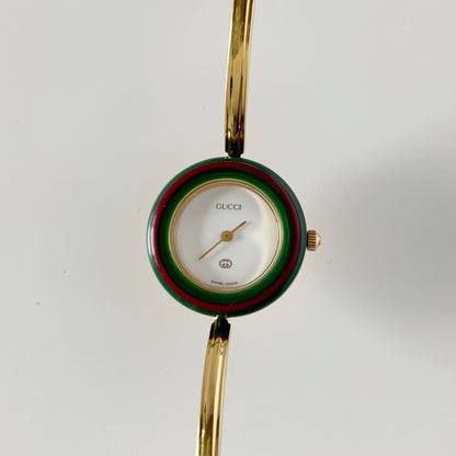 Gucci 1990s Interchangeable Bezel Gold Plated Bangle Watch with 12 bezels, case