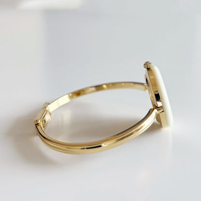 Gucci 1990s Interchangeable Bezel Gold Plated Bangle Watch with 12 bezels, case