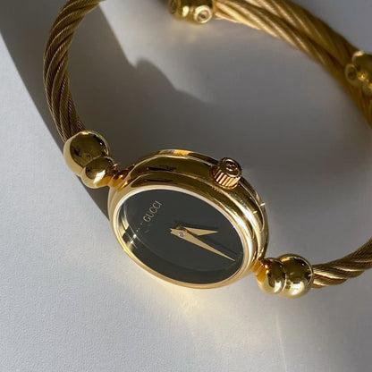 Gucci 1990s Black Dial Gold Plated Bangle Watch