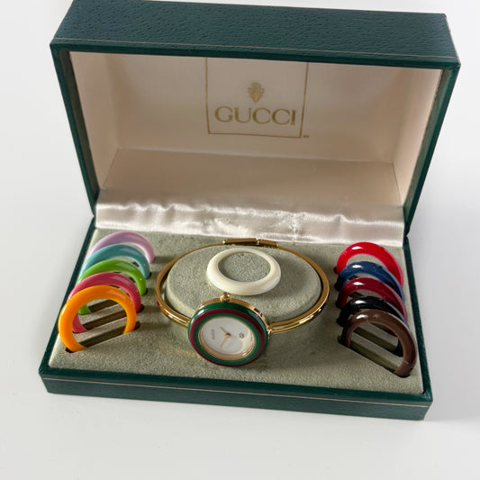 Gucci 1990s Interchangeable Bezel Gold Plated Bangle Watch with 12 bezels, case