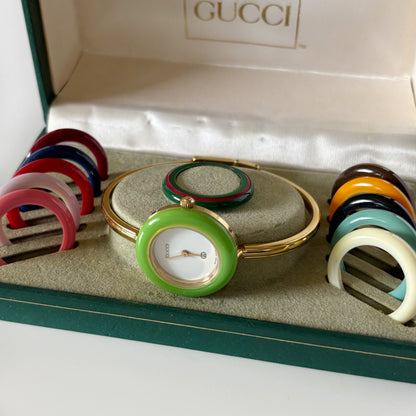 Gucci 1990s Interchangeable Bezel Gold Plated Bangle Watch with 12 bezels, case