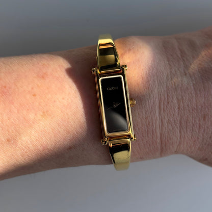 Gucci 1990s Black Rectangular Dial Gold Plated Bangle Watch