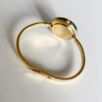 Gucci 1990s Interchangeable Bezel Gold Plated Bangle Watch with 12 bezels, case