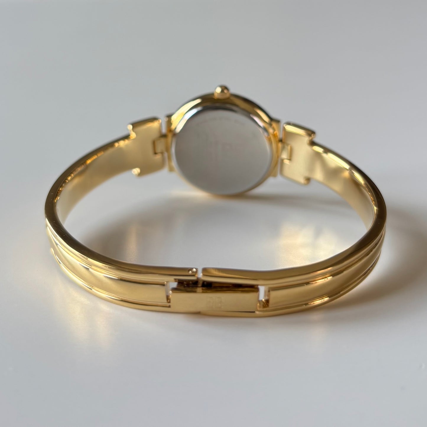 Givenchy 1990s Black Round Dial Gold Plated Bangle Watch