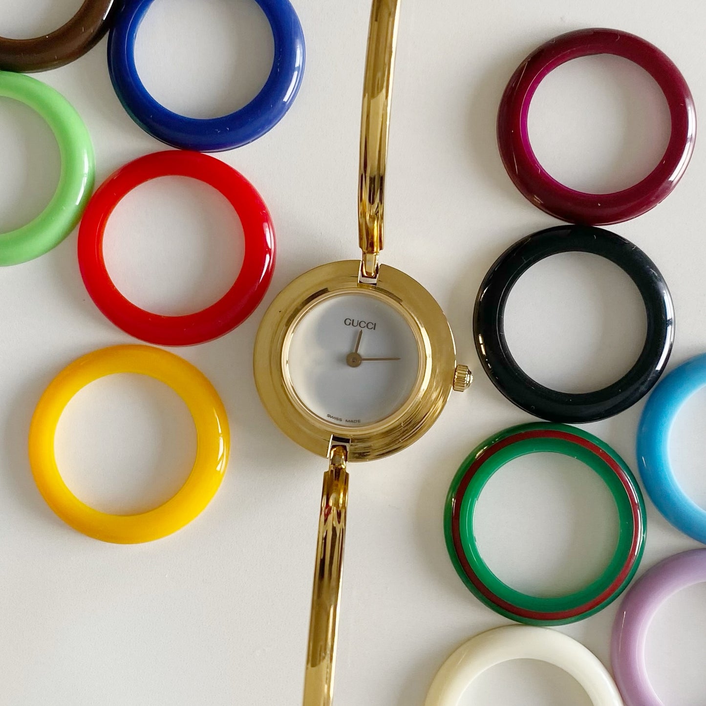 Gucci 1990s Interchangeable Bezel Gold Plated Bangle Watch with 12 bezels, case