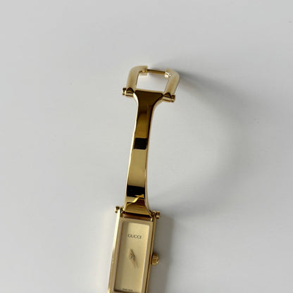 Gucci 1990s Rectangular Gold Dial Gold Plated Bangle Watch (Small)