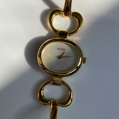 Gucci 1990s Seashell Dial Oval Gold Plated Bangle Watch