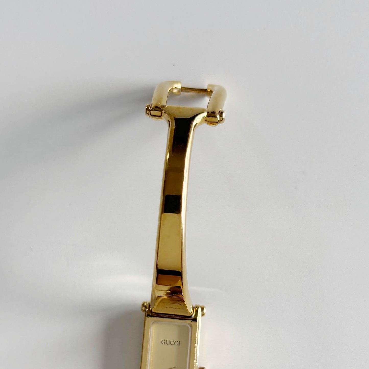 Gucci 1990s Gold Rectangular Dial Gold Plated Bangle Watch
