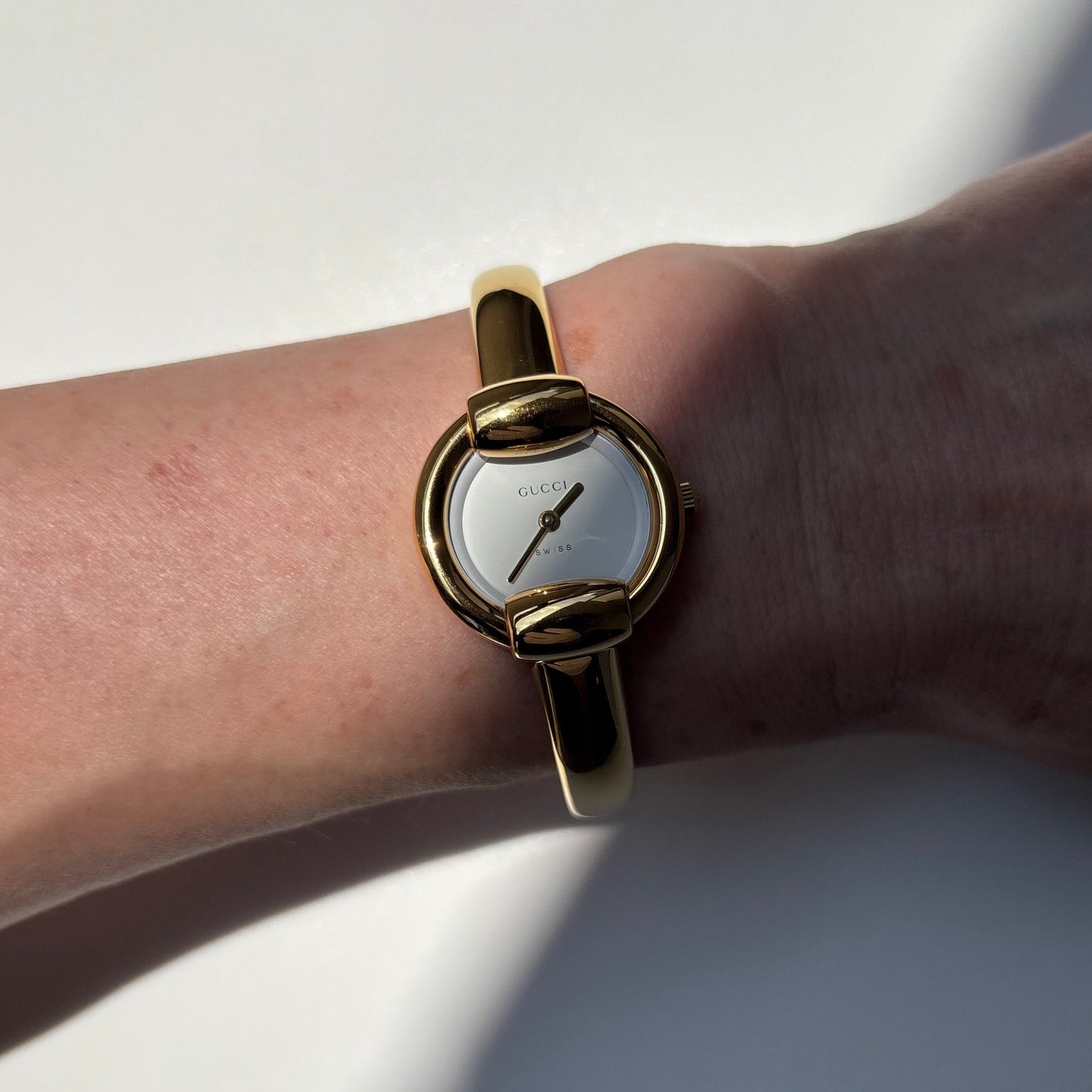 Gucci 1990s Round Dial Gold Plated Bangle Watch