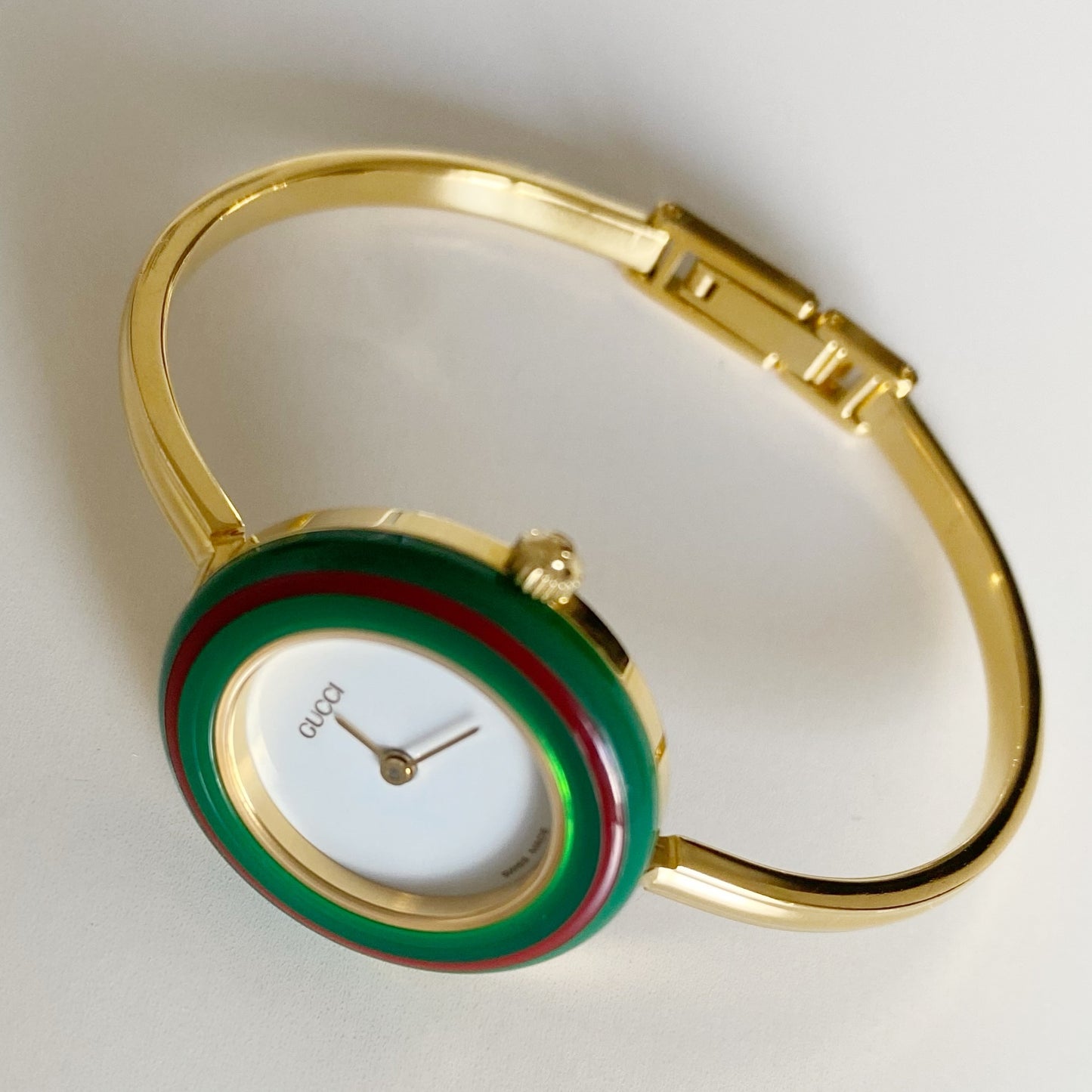 Gucci 1990s Interchangeable Bezel Gold Plated Bangle Watch with 12 bezels, case