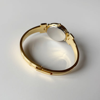 Givenchy 1990s Round Dial Gold Plated Bangle Watch
