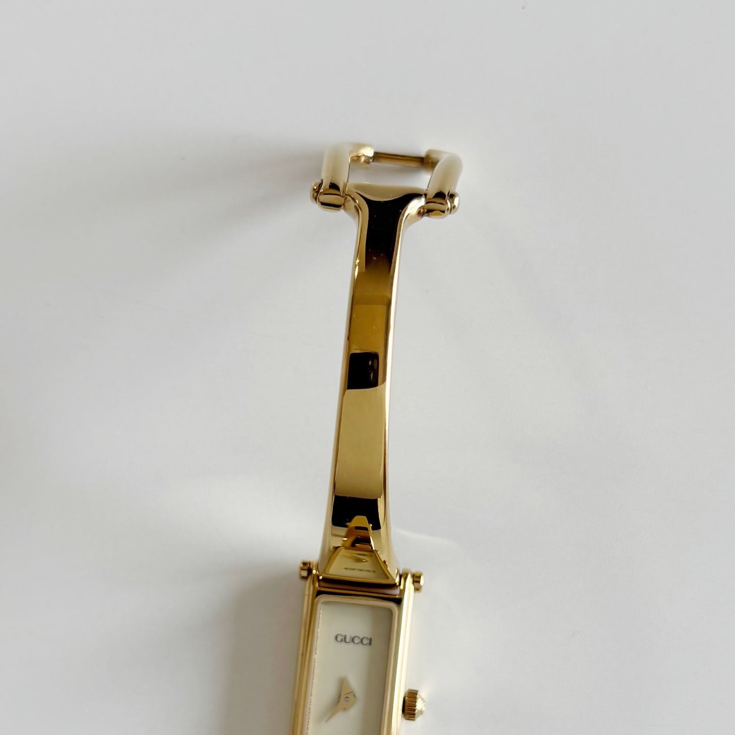 Gucci 1990s Cream Dial Rectangular Gold Plated Bangle Watch