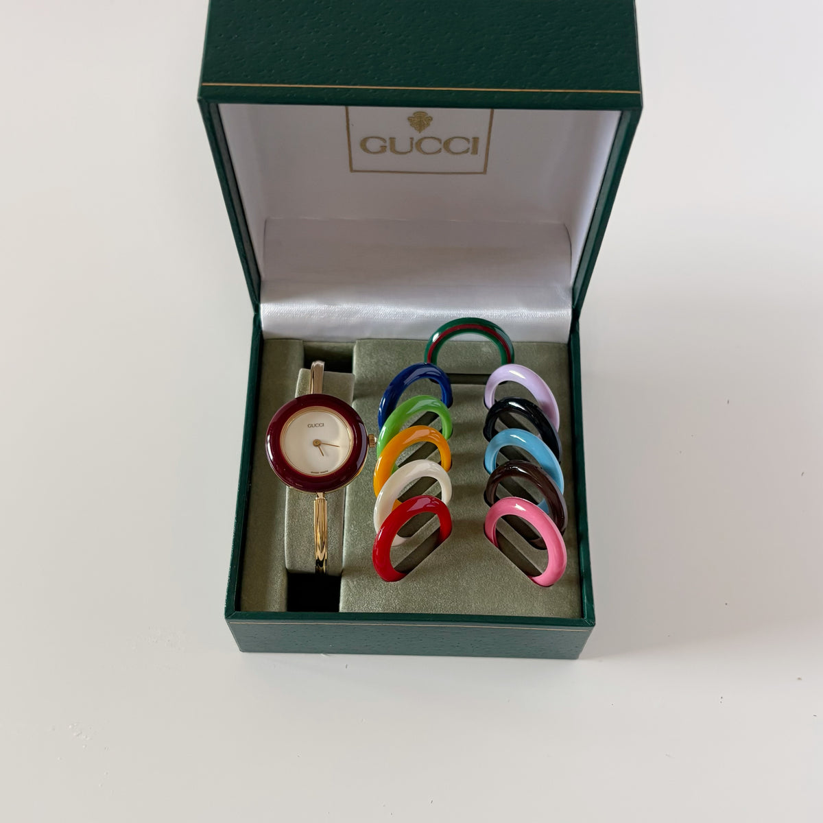 Gucci 1990s Interchangeable Bezel Gold Plated Bangle Watch with 12 bezels, case