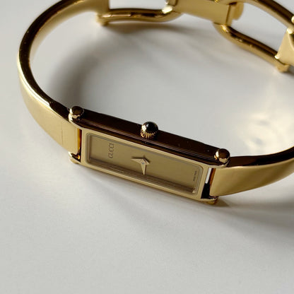 Gucci 1990s Gold Rectangular Dial Gold Plated Bangle Watch