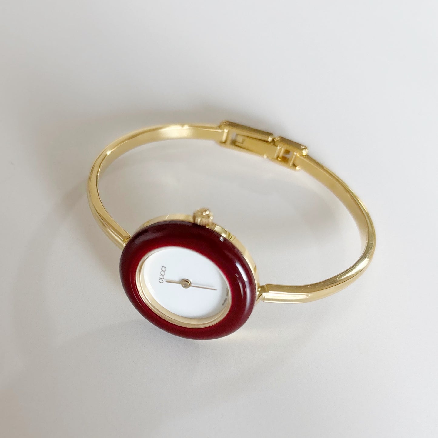 Gucci 1990s Interchangeable Bezel Gold Plated Bangle Watch with 12 bezels, case