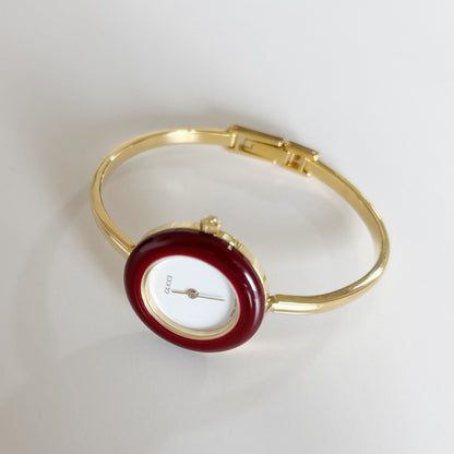 Gucci 1990s Interchangeable Bezel Gold Plated Bangle Watch with 12 bezels, case