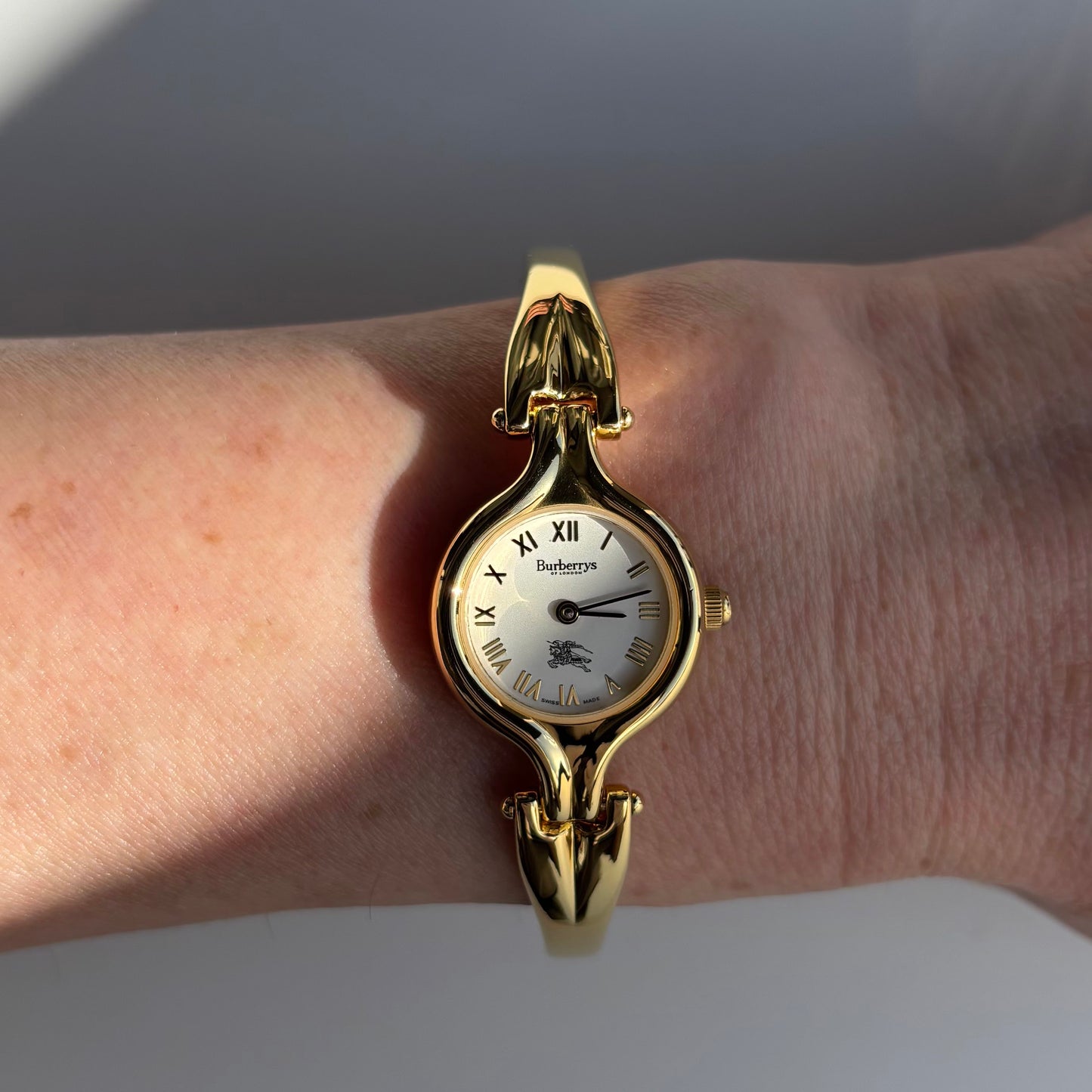 Burberry 1990s Round Dial Gold Plated Bangle Watch