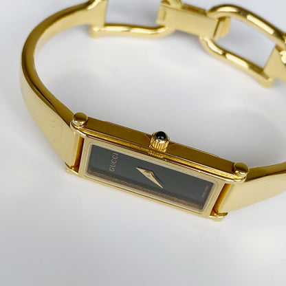 Gucci 1990s Black Dial Rectangular Gold Plated Bangle Watch